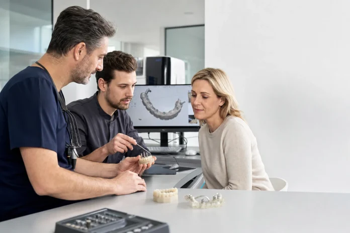 Dental team reviewing an All-on-6 implant-supported bridge plan with a patient