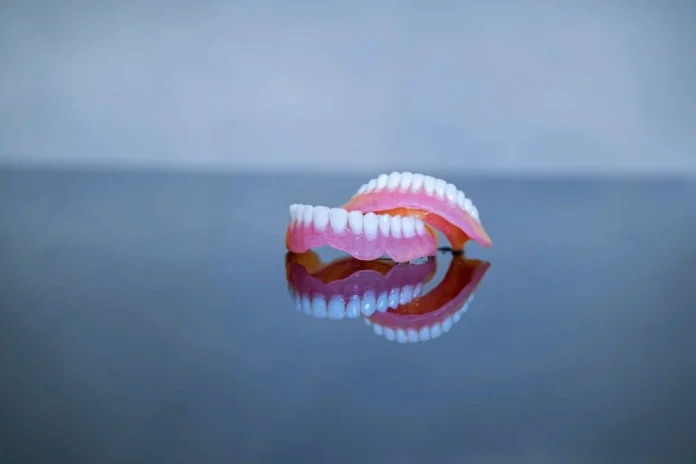 Dental bridge treatment planning with a dental model at City Dental Clinic in Tirana